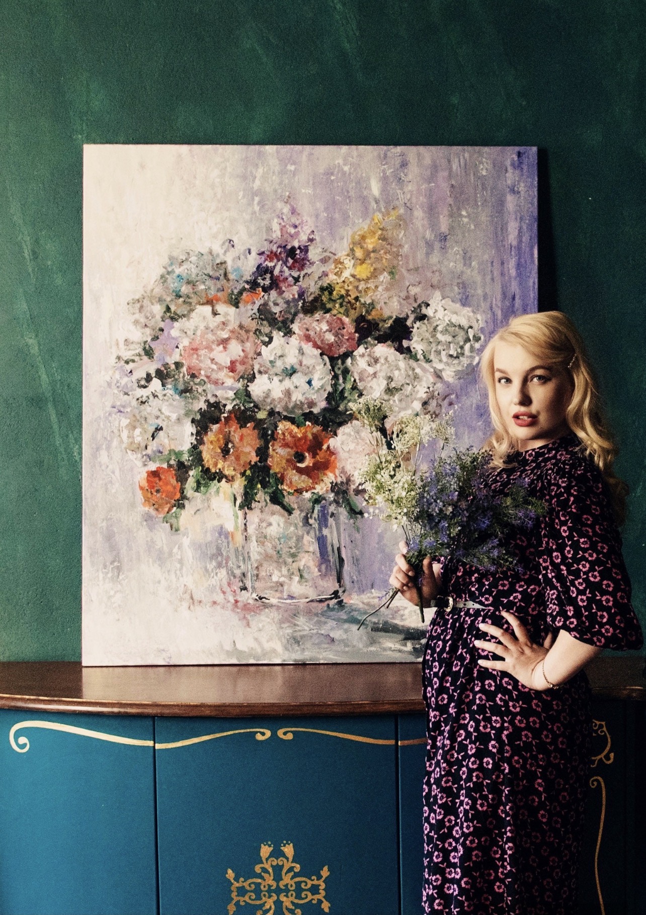 Marina Stognieva with the completed painting Flowers on a Purple Background. Bouquet of Joy in an interior